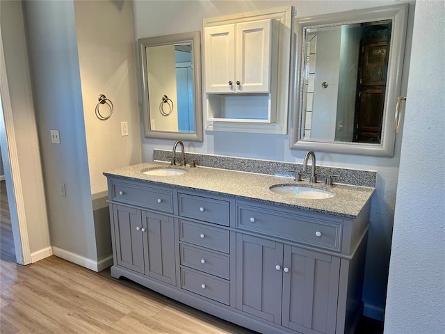 bathroom featuring hardwood / wood-style floors and vanity