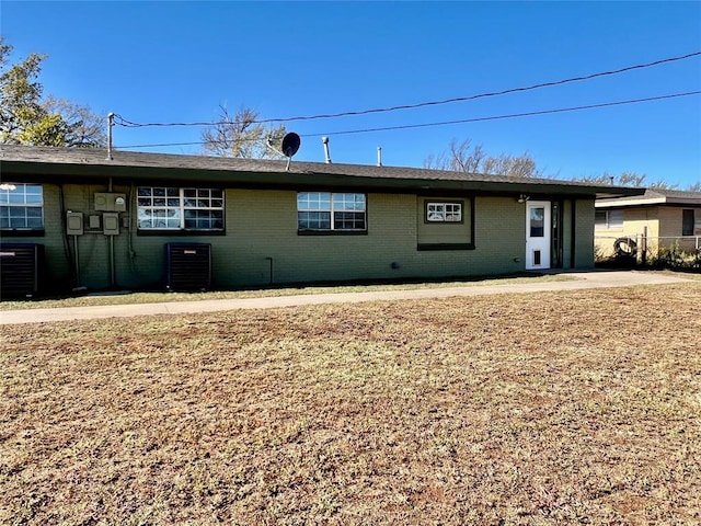 single story home featuring cooling unit