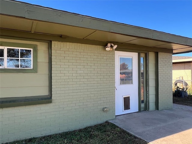 doorway to property with a patio