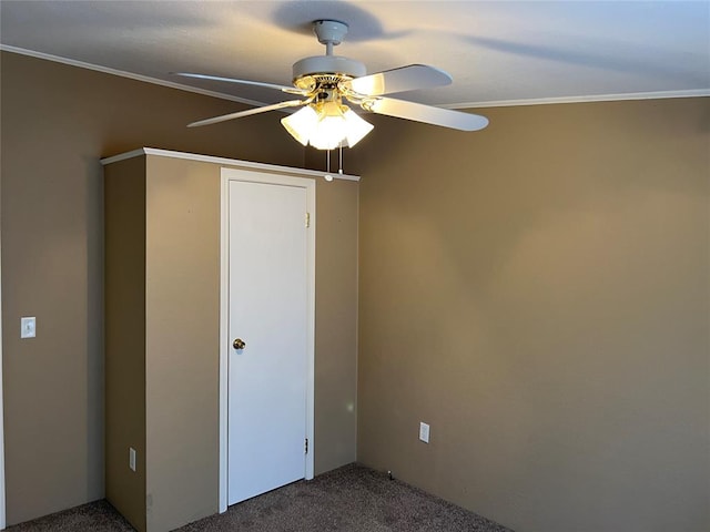 unfurnished bedroom with ceiling fan, carpet floors, and ornamental molding