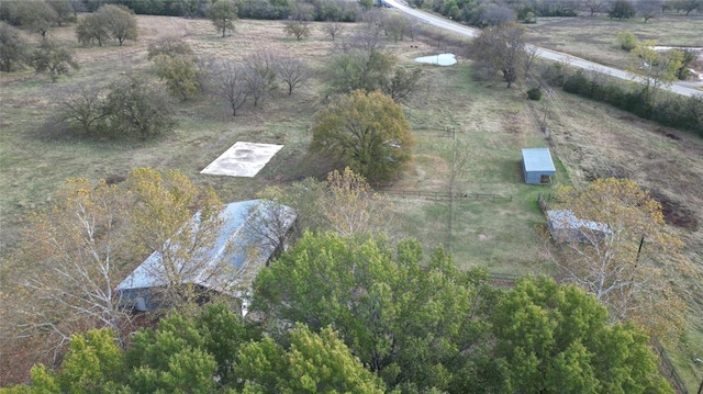 birds eye view of property with a rural view