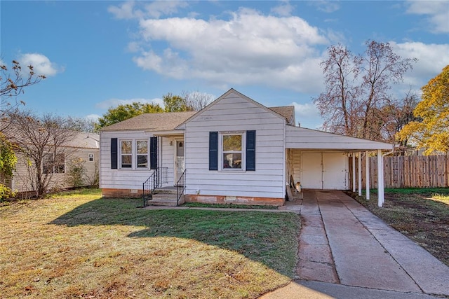 view of front of property with a carport and a front yard