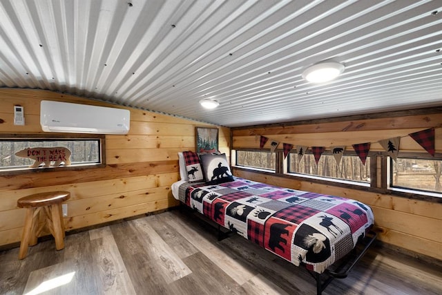 bedroom featuring wood-type flooring, vaulted ceiling, an AC wall unit, and wood walls