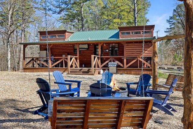 exterior space featuring a fire pit