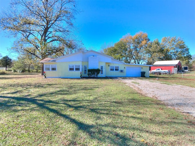 single story home with a front lawn and a garage