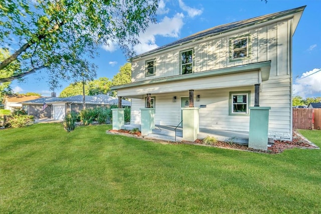 back of property featuring a lawn