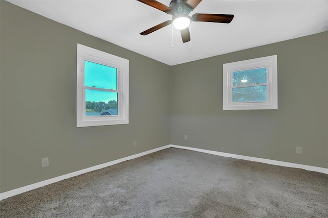 empty room featuring ceiling fan and carpet floors