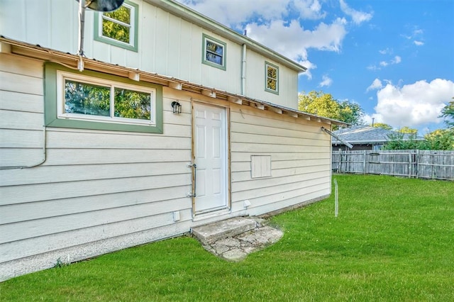 view of outbuilding with a lawn