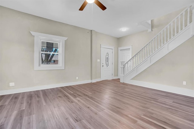 entryway with hardwood / wood-style floors and ceiling fan