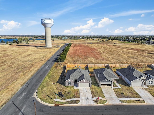 birds eye view of property with a rural view