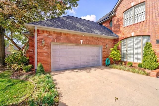 garage featuring driveway