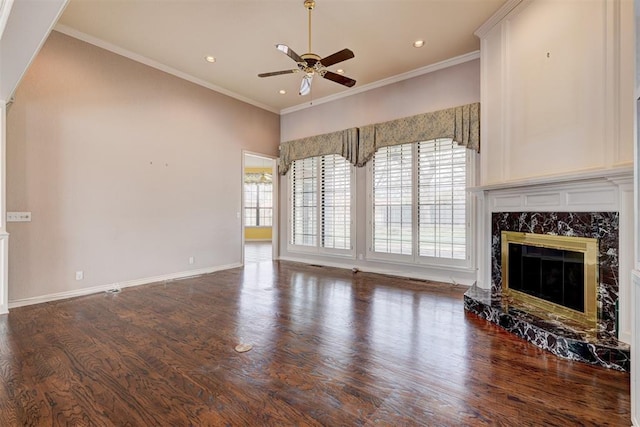 unfurnished living room featuring plenty of natural light, wood finished floors, and a fireplace