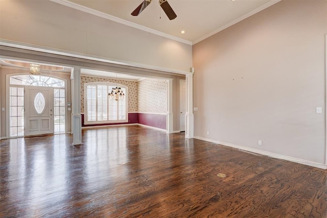 unfurnished living room with wood finished floors, baseboards, a high ceiling, ceiling fan, and ornamental molding