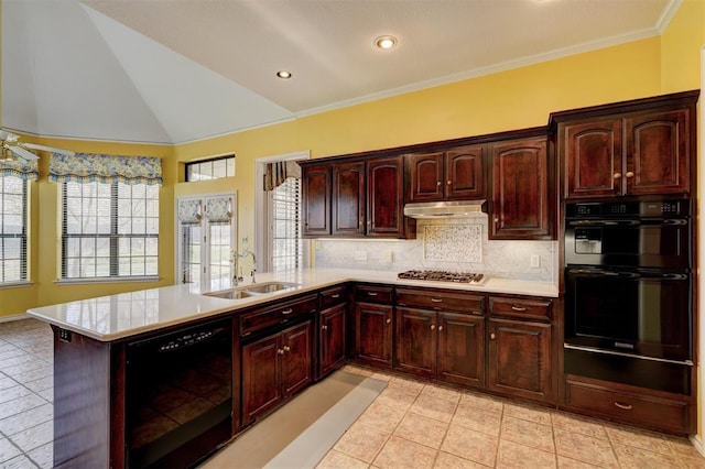 kitchen featuring a sink, black appliances, light countertops, under cabinet range hood, and backsplash