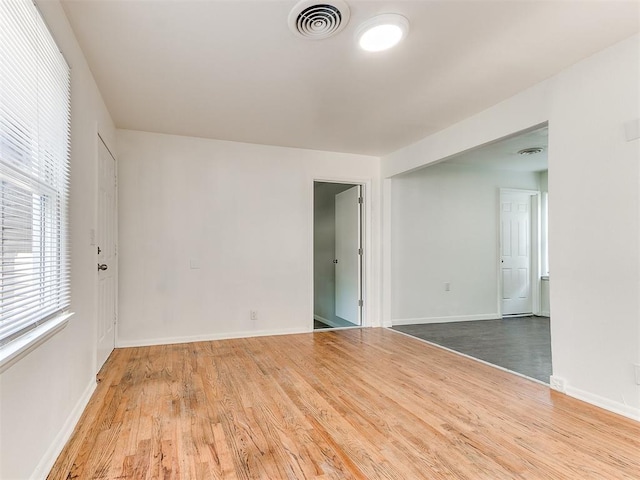 empty room featuring hardwood / wood-style flooring