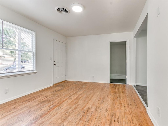 empty room with wood-type flooring