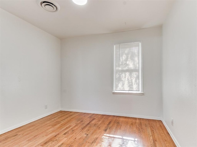 empty room with light hardwood / wood-style floors