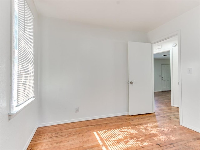 spare room with light hardwood / wood-style floors