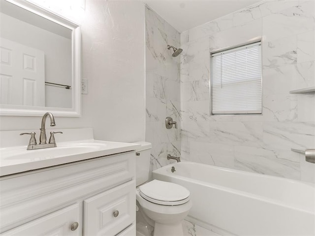 full bathroom with vanity, toilet, and tiled shower / bath