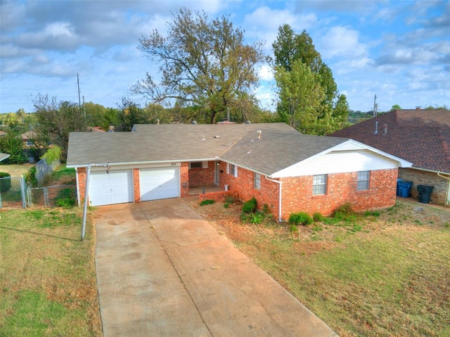 ranch-style house with a garage and a front lawn