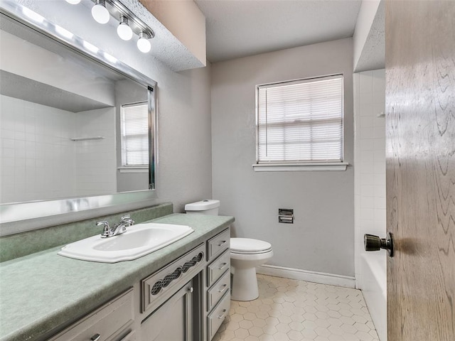 full bathroom featuring tile patterned floors, vanity, toilet, and tiled shower / bath