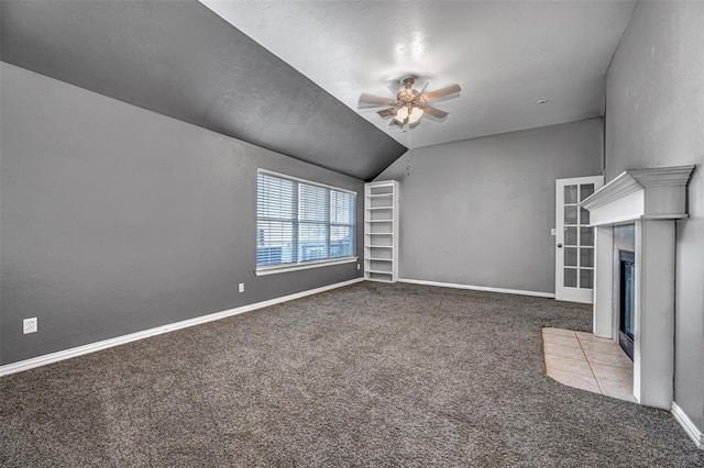 unfurnished living room with ceiling fan, light carpet, and vaulted ceiling