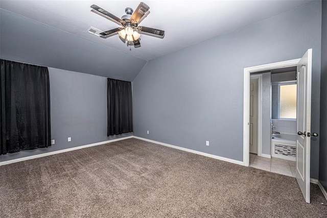 unfurnished bedroom featuring carpet flooring, ceiling fan, and lofted ceiling