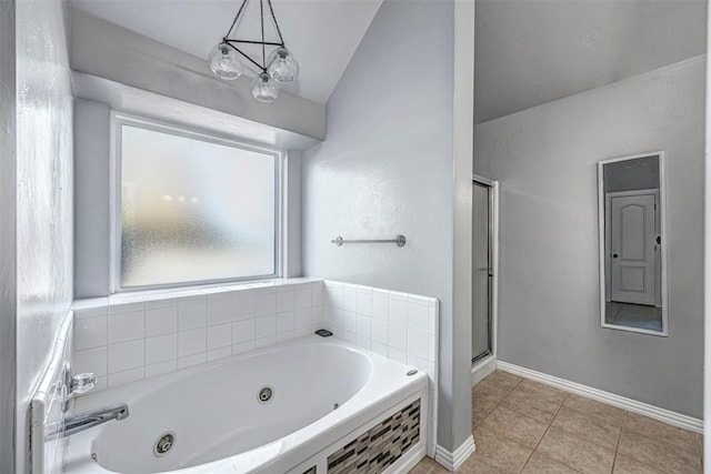 bathroom with tile patterned floors, separate shower and tub, and vaulted ceiling