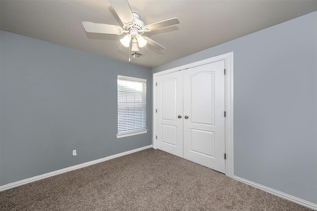 unfurnished bedroom featuring carpet flooring, ceiling fan, and a closet