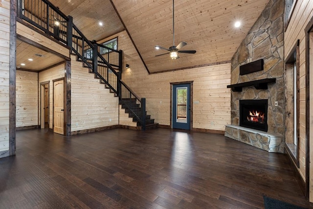 unfurnished living room with dark hardwood / wood-style floors, wood walls, wooden ceiling, and high vaulted ceiling