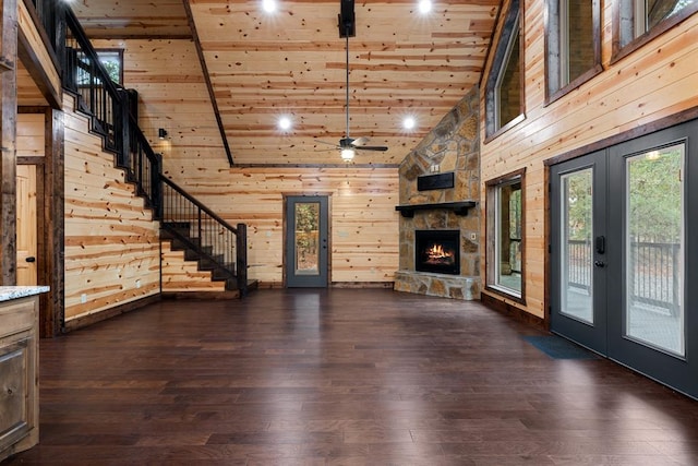 unfurnished living room featuring wood ceiling, dark wood-type flooring, high vaulted ceiling, and french doors