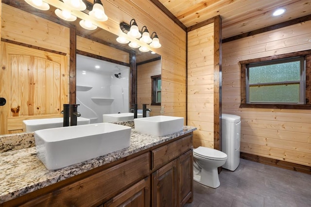 bathroom featuring vanity, toilet, wooden ceiling, and wooden walls