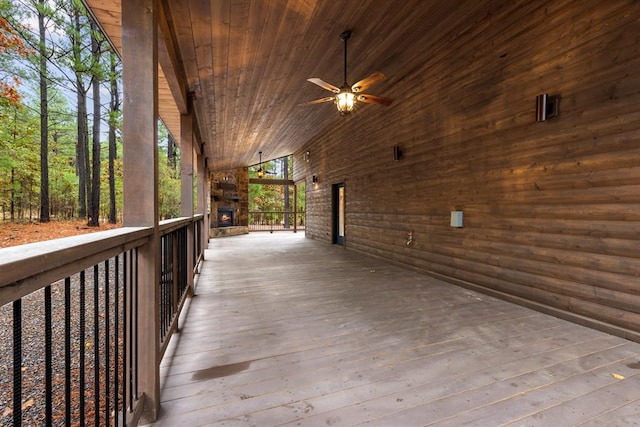 wooden terrace featuring ceiling fan