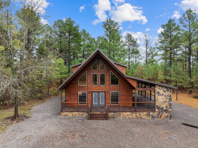 72 Xpress Ln, Broken Bow, OK 74728 - view of front of property featuring faux log siding, gravel driveway, covered porch, french doors, and a wooded view