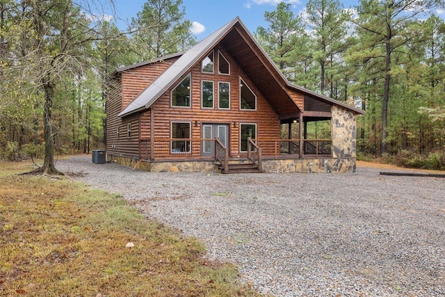 72 Xpress Ln, Broken Bow, OK 74728 - view of front of property with log veneer siding and central air condition unit
