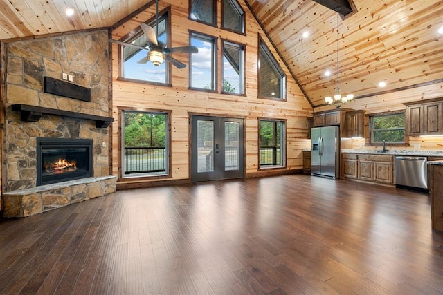72 Xpress Ln, Broken Bow, OK 74728 - unfurnished living room with high vaulted ceiling, wood ceiling, a ceiling fan, a sink, and a fireplace