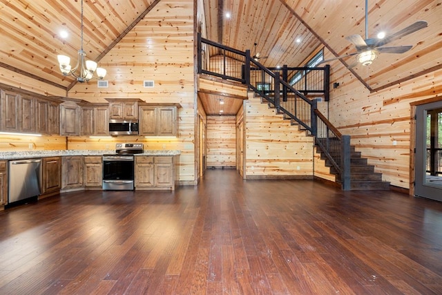 kitchen with light stone countertops, stainless steel appliances, high vaulted ceiling, wooden ceiling, and dark hardwood / wood-style floors