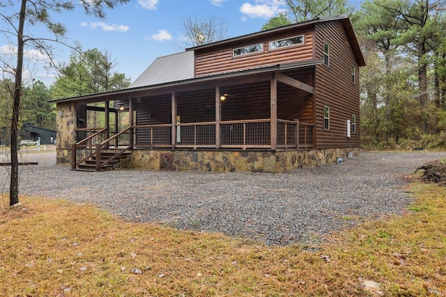 72 Xpress Ln, Broken Bow, OK 74728 - view of front of property with faux log siding and metal roof