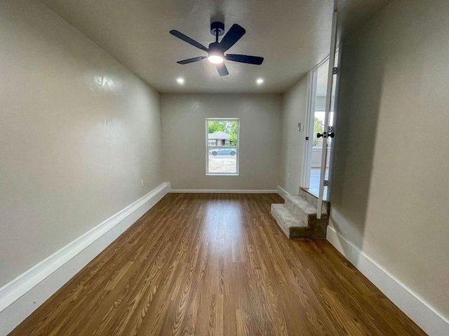 unfurnished room featuring ceiling fan and wood-type flooring