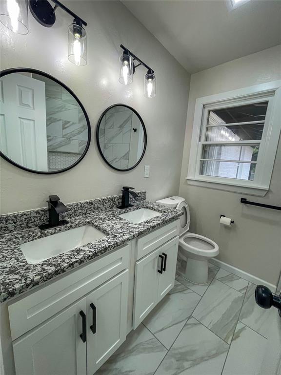 bathroom with vanity and toilet