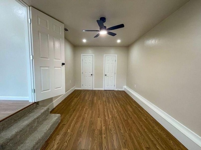 interior space featuring ceiling fan and dark hardwood / wood-style floors