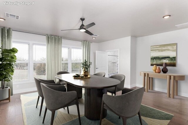 dining room featuring ceiling fan and dark hardwood / wood-style floors