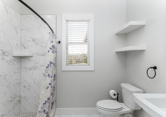 bathroom featuring sink, toilet, a healthy amount of sunlight, and a shower with shower curtain