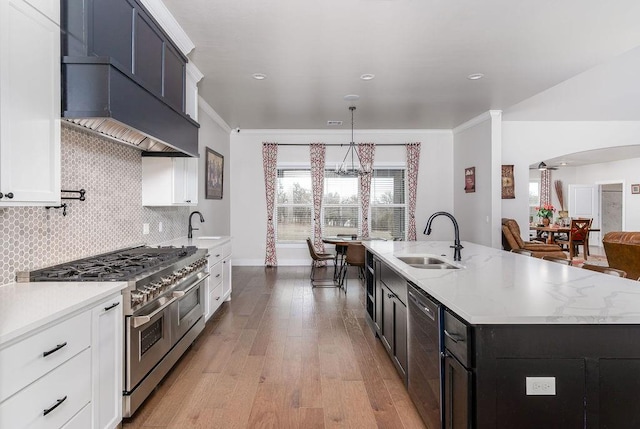 kitchen featuring appliances with stainless steel finishes, light hardwood / wood-style flooring, crown molding, and sink