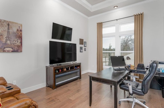 office space featuring wood-type flooring and crown molding