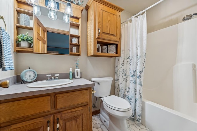 full bathroom featuring tile patterned floors, vanity, toilet, and shower / bath combo with shower curtain