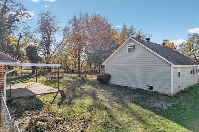 view of property exterior featuring a yard and a patio