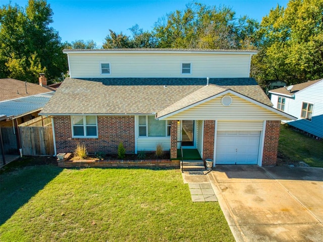 front of property with a front yard and a garage