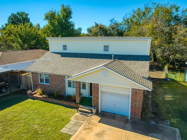 view of front of property with a garage and a front lawn