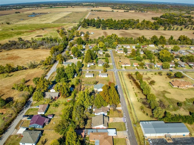 birds eye view of property with a rural view